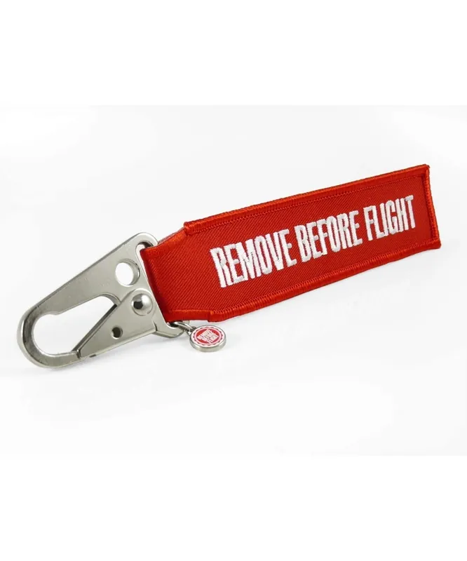 Nur Heute REMOVE BEFORE FLIGHT Strap - mit Schnabel-Karabiner